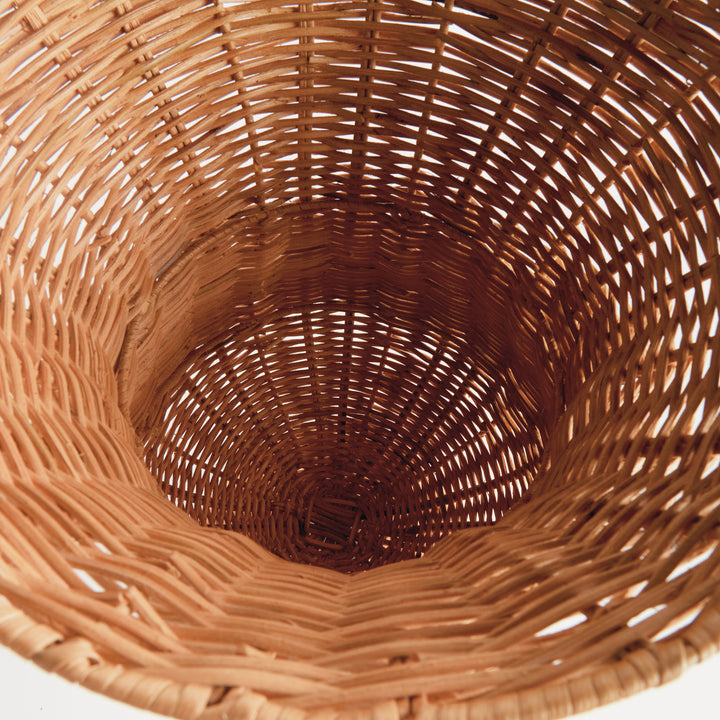 Top view of the natural handwoven rattan footed urn displaying the woven interior and artisan construction – Coastal.