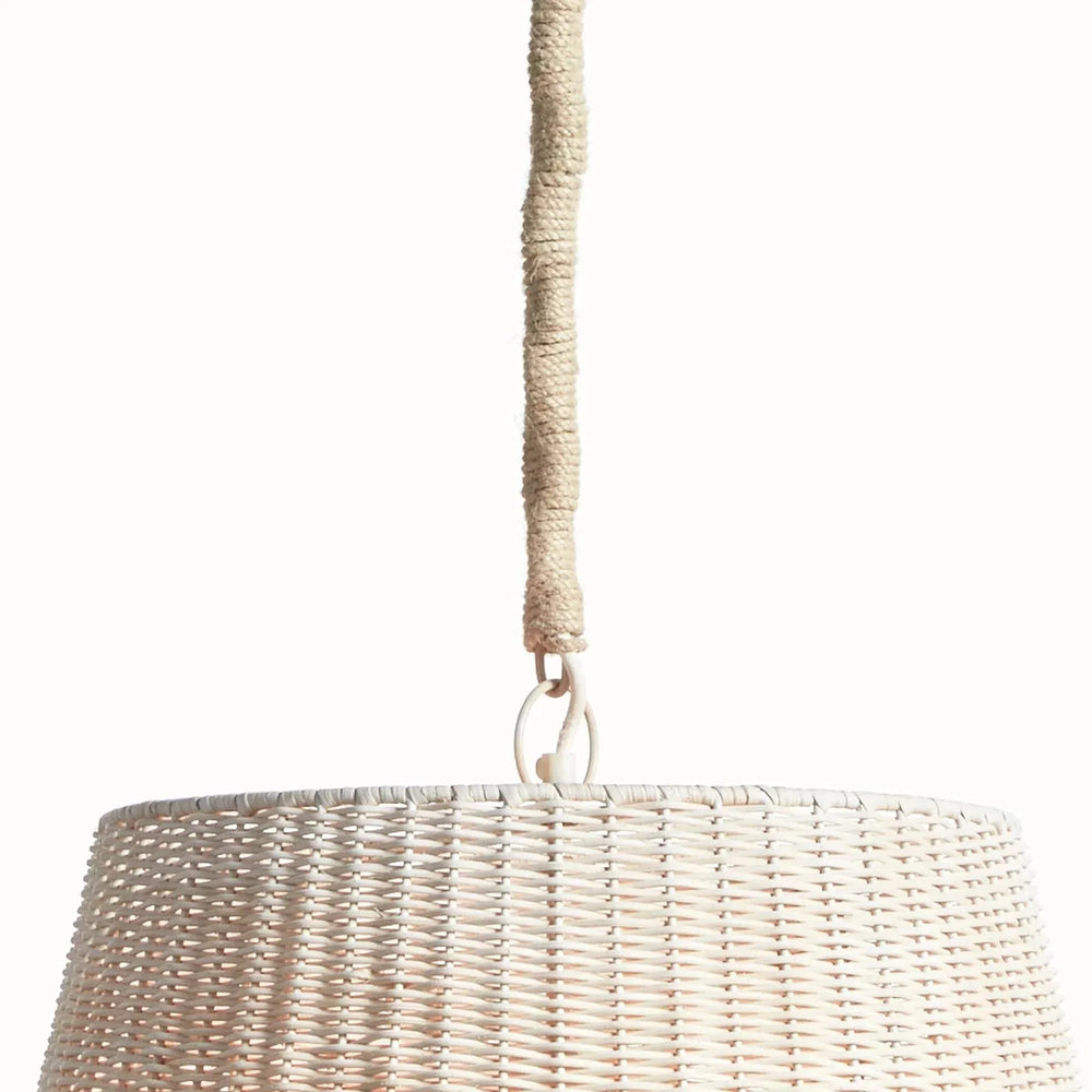 Detail of natural rattan pendant light showing the jute-wrapped chain, metal hanging loop and woven rattan shade in Coastal