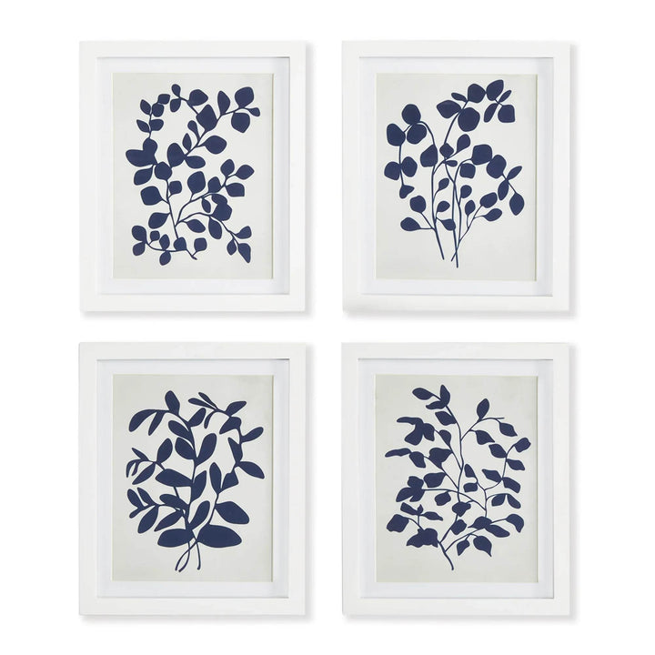 Navy botanical leaf art print set of 4 framed on white wall gallery-style.