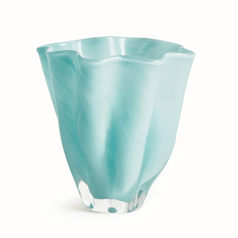 Light blue mouth-blown glass vase with a tall tapered body, flowing waved rim and soft mottled white and aqua color. Coastal