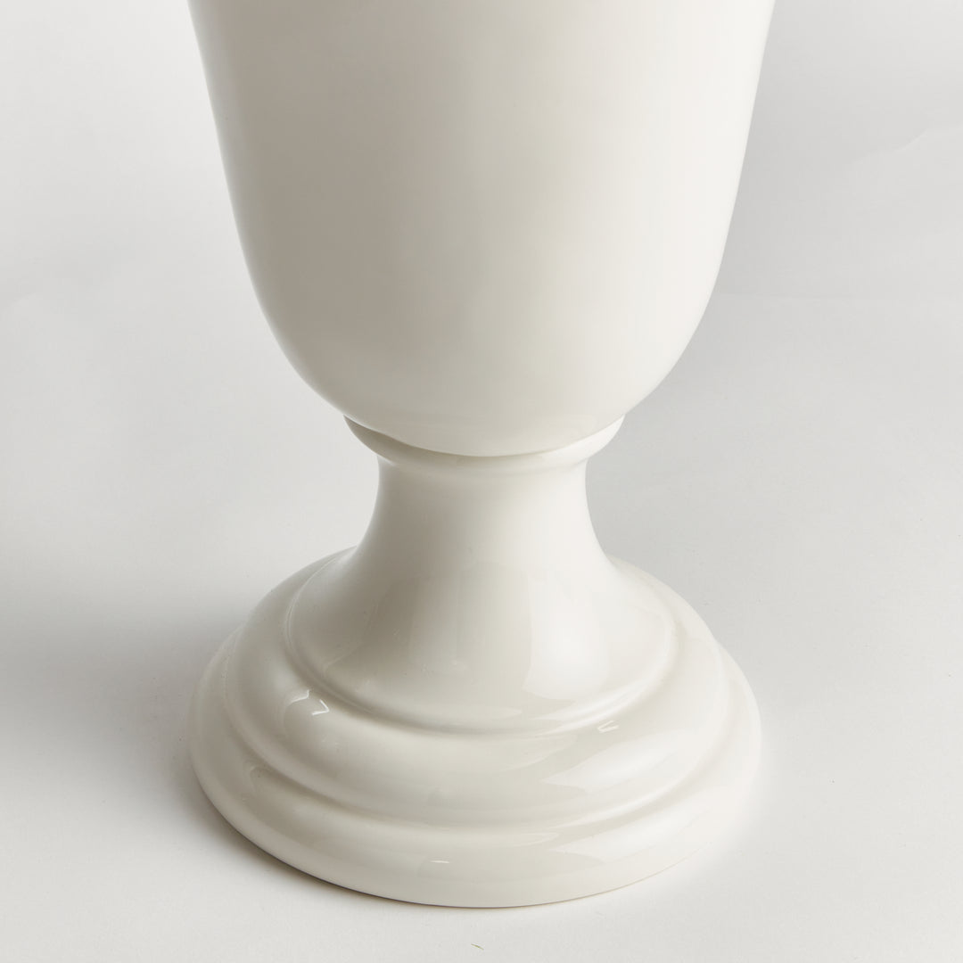Detail of a white clay trumpet vase showing the narrow lower body, curving pedestal stem and circular foot | Traditional