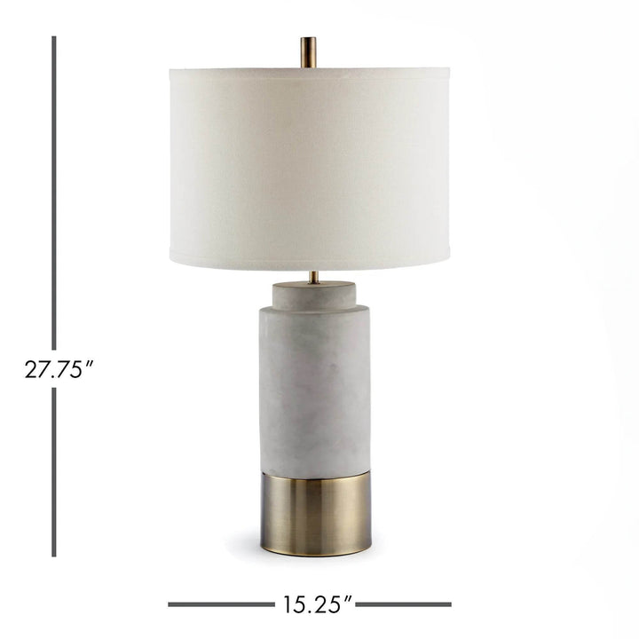 Organic modern concrete and brass table lamp with labeled dimensions, 27.75 inches tall by 15.25 wide