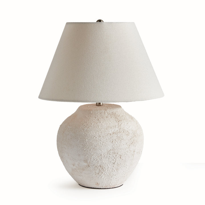 Orla white ceramic table lamp with a rounded textured base, tapered light linen shade and small metal finial. Modern Organic