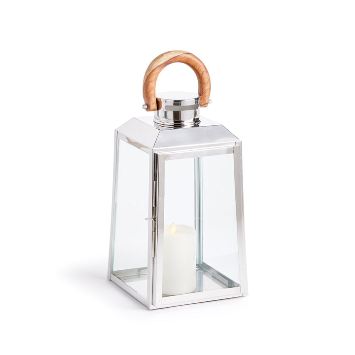 Small outdoor stainless steel lantern with clear glass panels and teak wood handle on white background coastal lantern