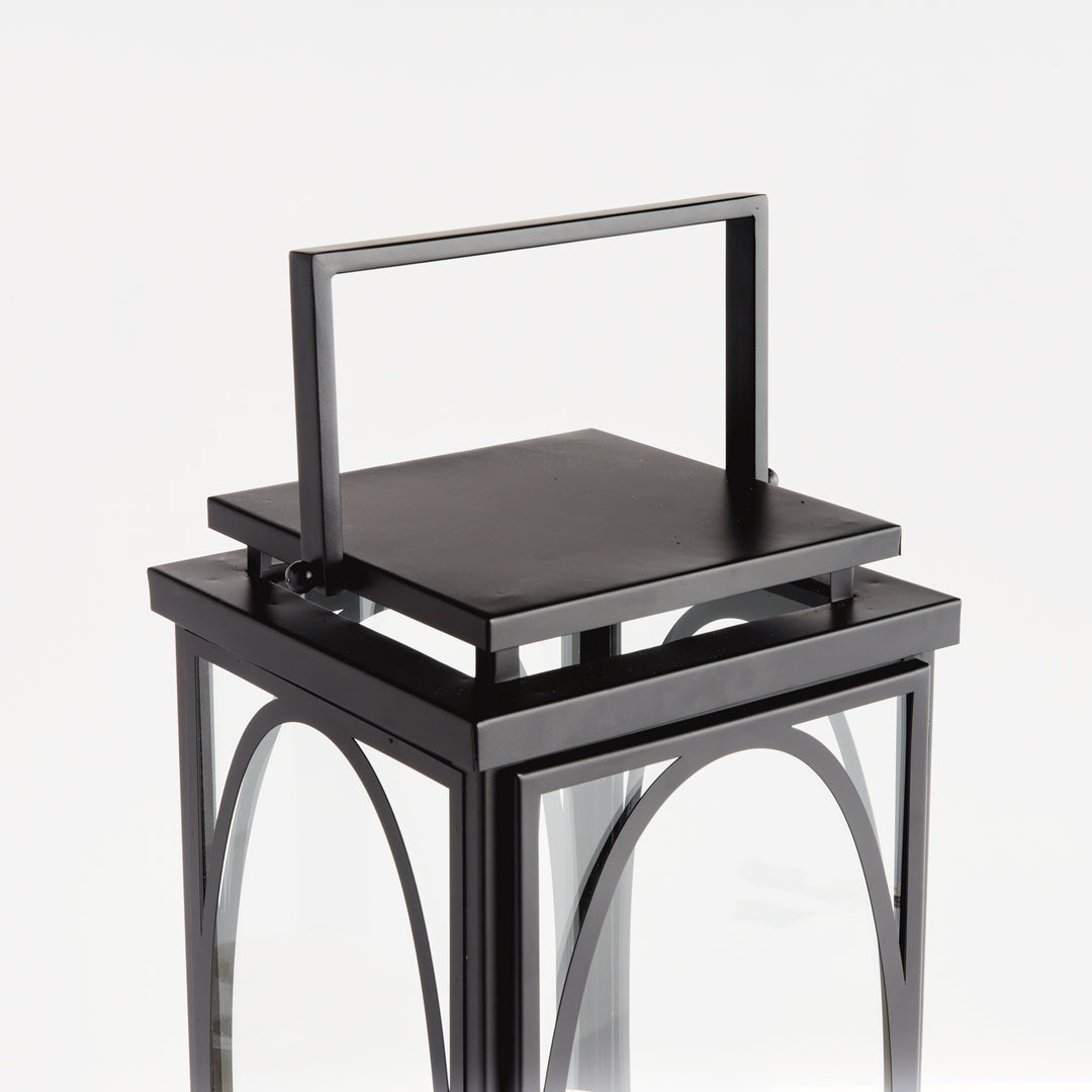 Black oval frame candle lantern with structured top handle and clean transitional styling for indoor décor lantern