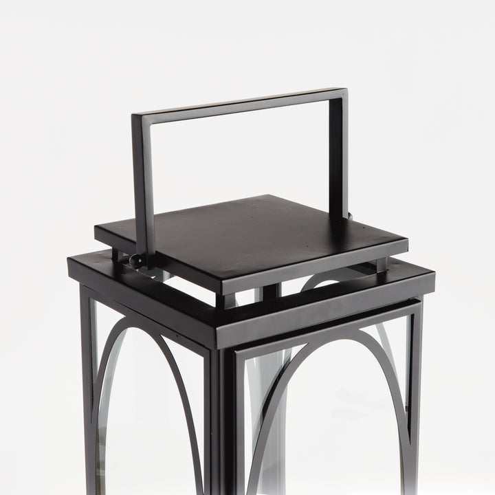 Black oval frame candle lantern with structured top handle and clean transitional styling for indoor décor lantern