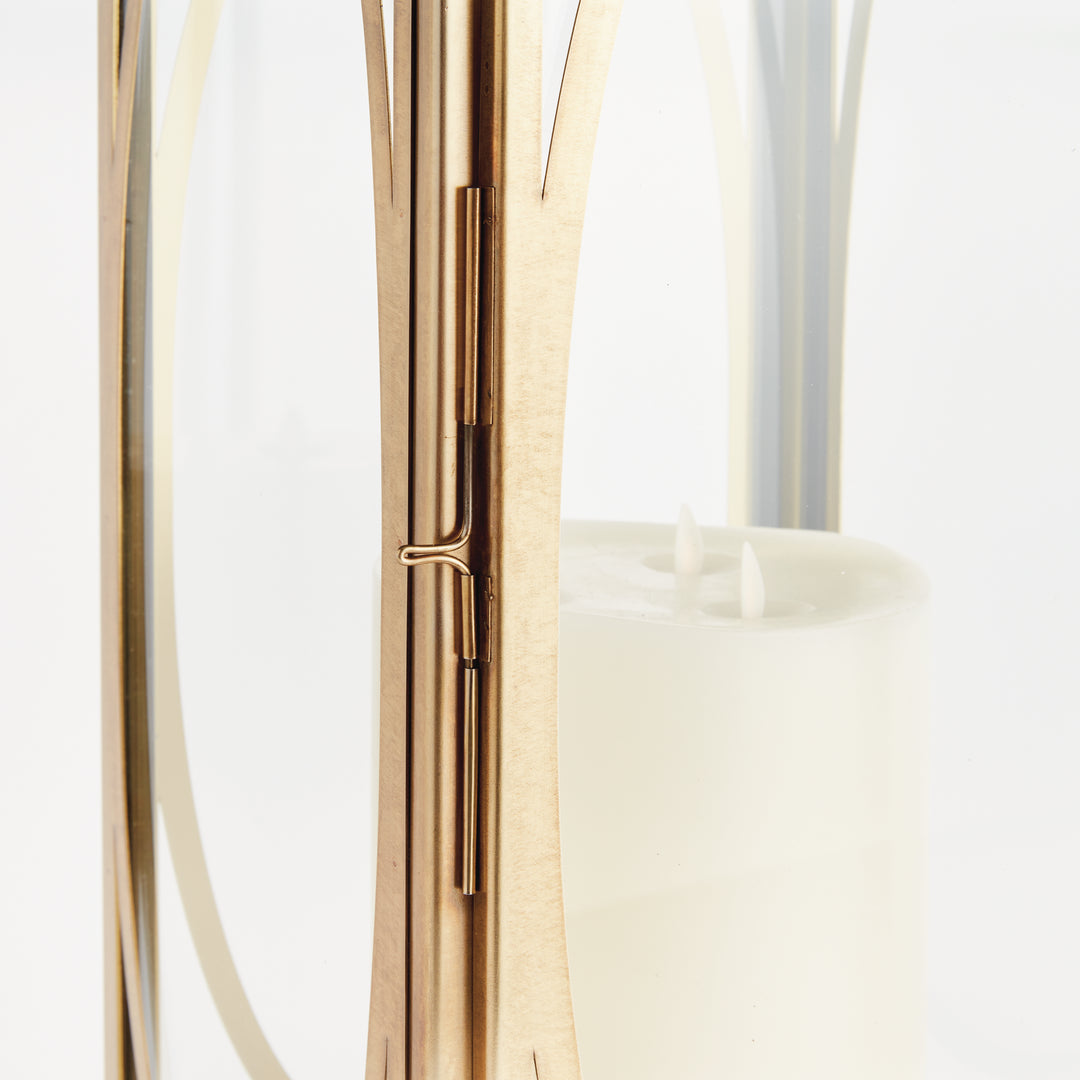 Close-up detail of brass oval frame candle lantern showing architectural metalwork for transitional décor lantern