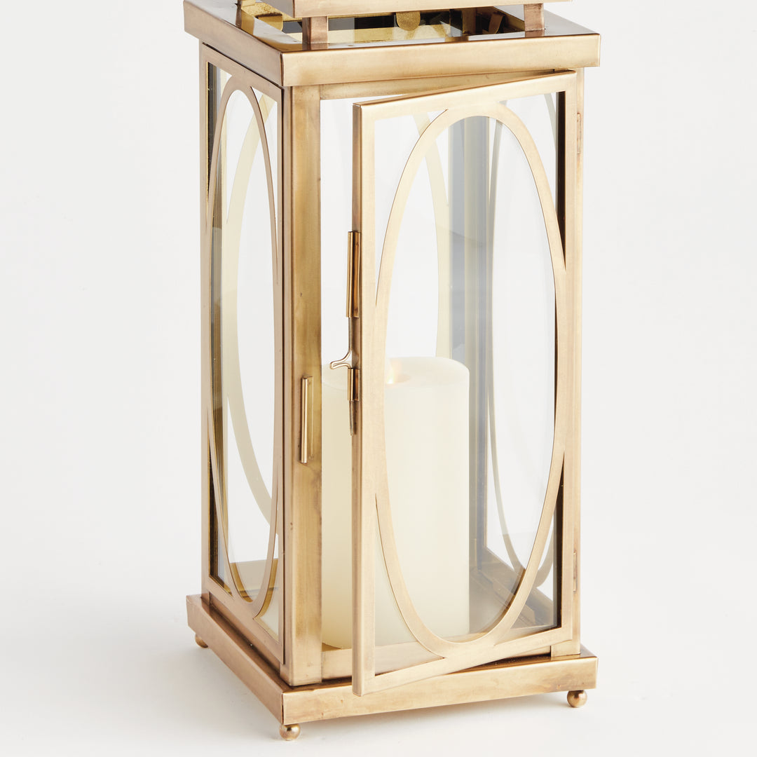 Large brass oval frame candle lantern with open glass door and flameless candle for architectural décor lantern