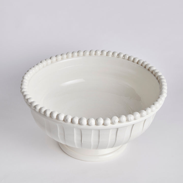 Overhead angle of white coastal transitional ceramic bowl with rounded profile and depth

