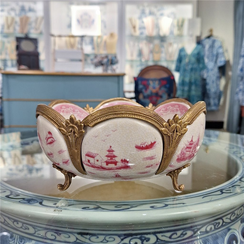 Pink chinoiserie porcelain decorative bowl with bronze ormolu feet styled on tabletop display – Traditional style