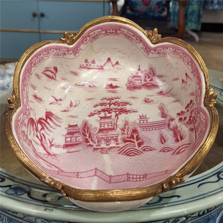 Top detail of pink chinoiserie porcelain decorative bowl with scalloped rim and scenic artwork – Traditional style