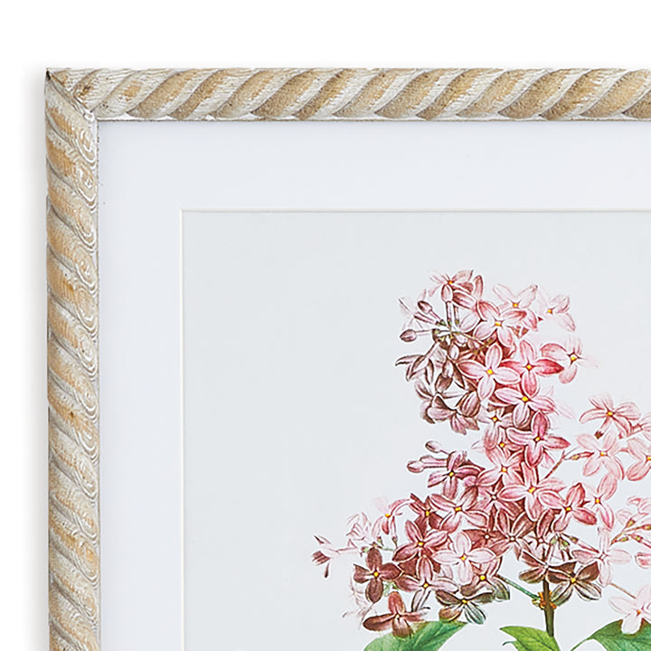 Close view of a pink lilac botanical print, showing the pale mat and twist-effect frame around the floral image, Traditional