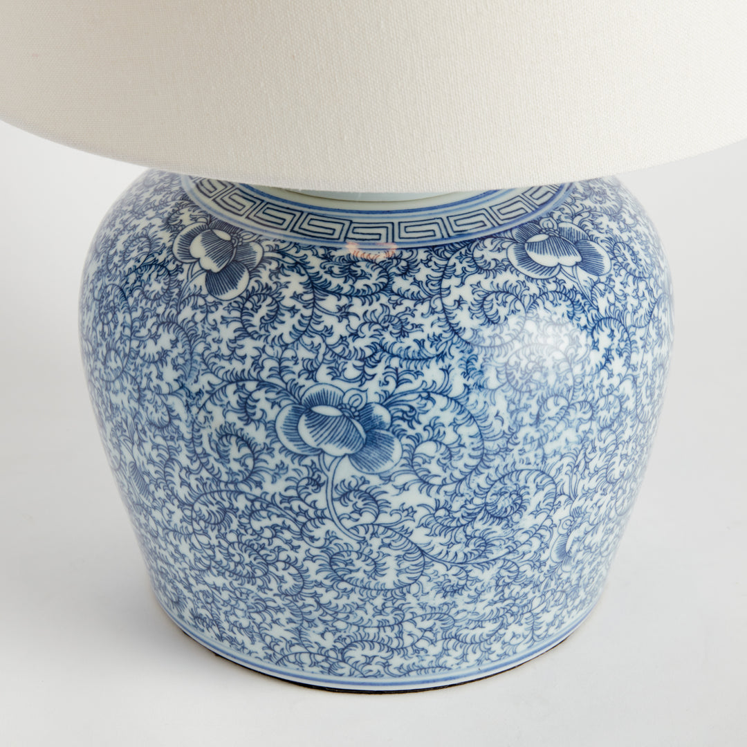 Close-up of hand-stamped cobalt floral pattern on porcelain lamp base with smooth glaze finish – Transitional style.