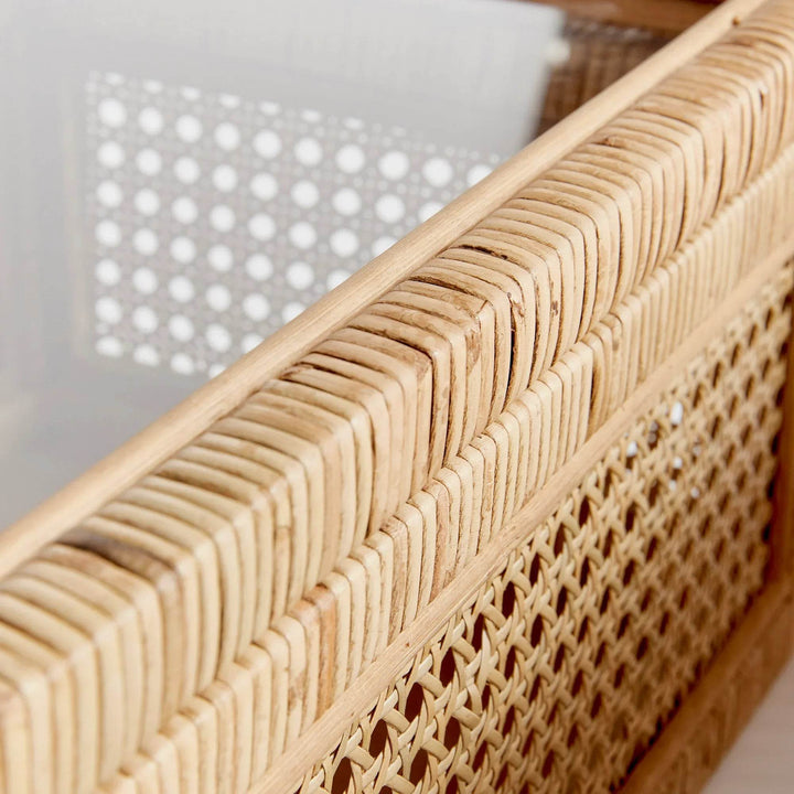 Macro detail of rattan wrapping and cane webbing panel along box edge, highlighting weave quality and framed trim – Coastal