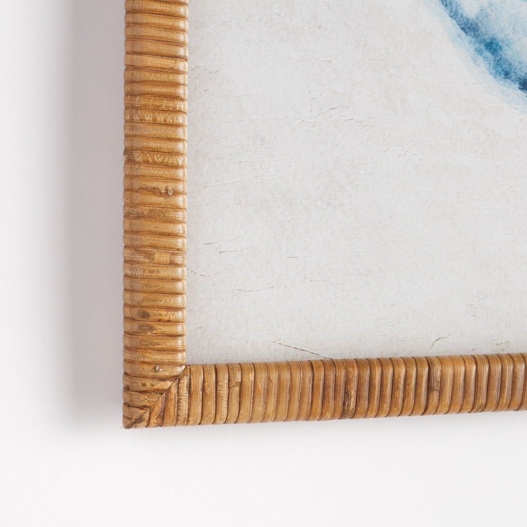 Close-up of natural rattan-wrapped frame corner on whale wall art print, highlighting woven texture and edge finish over neutral paper background – Coastal style.