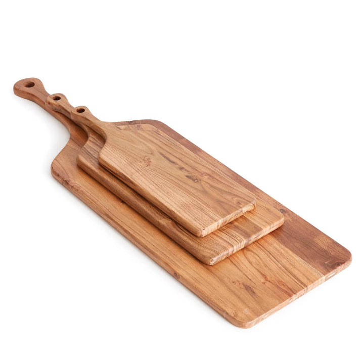 Close-up of acacia wood serving board showing natural knots, warm brown tones, and handle detail – Rustic.