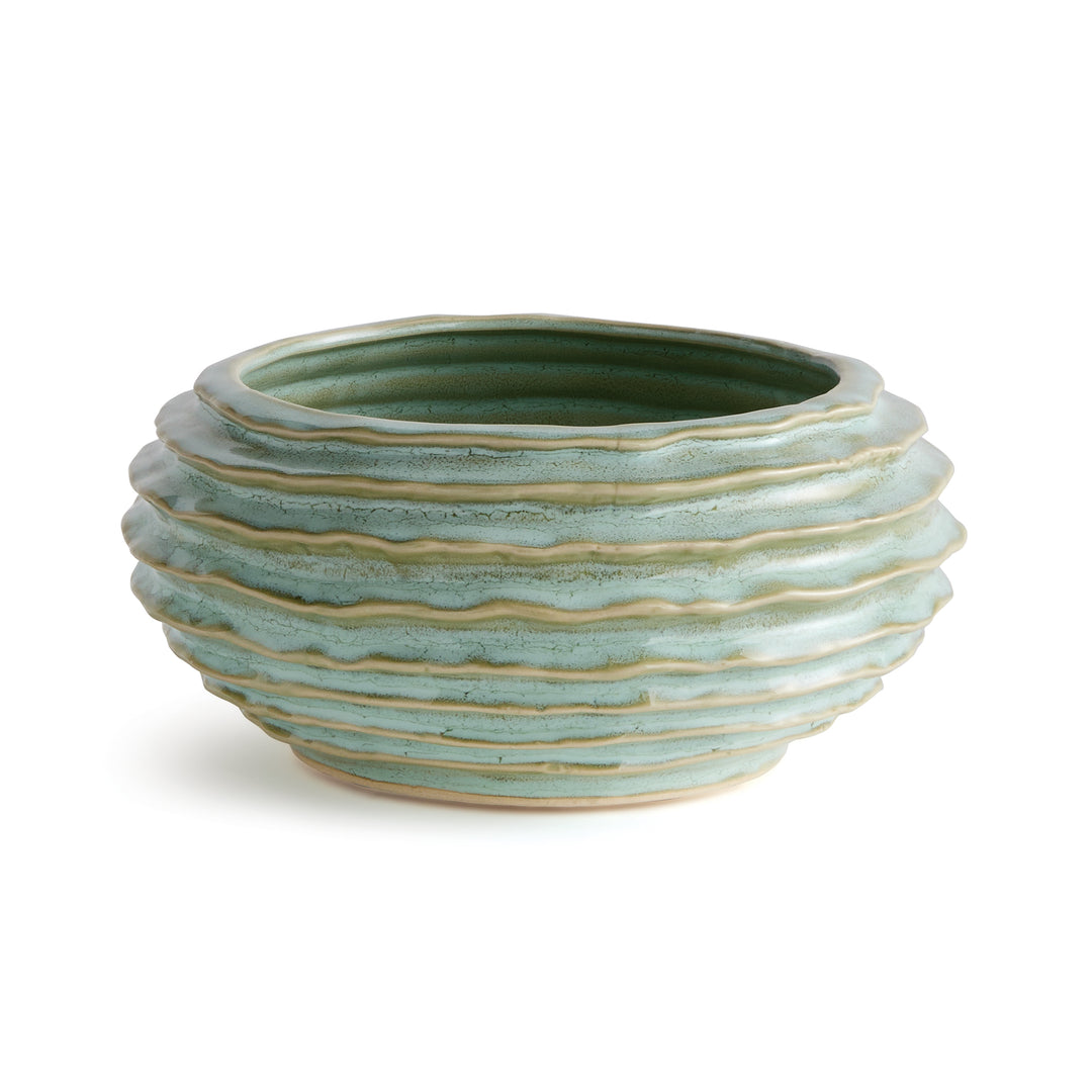Sage green ribbed ceramic decorative bowl with reactive glaze, light raised bands and rounded body on white - Modern Organic