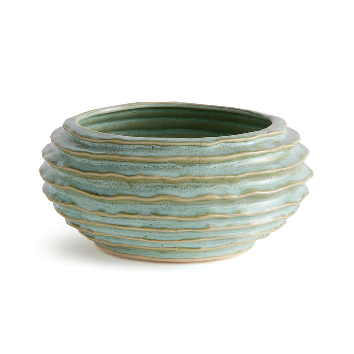 Sage green ribbed ceramic decorative bowl with reactive glaze, light raised bands and rounded body on white - Modern Organic