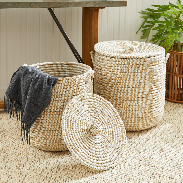Handwoven rivergrass hamper baskets styled with a throw for laundry, blankets, or living room storage – Coastal Organic.