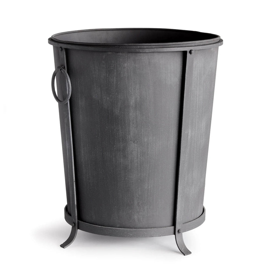 Large iron planter with a tapered round body, aged zinc finish, ring handles and a raised frame. Industrial Transitional