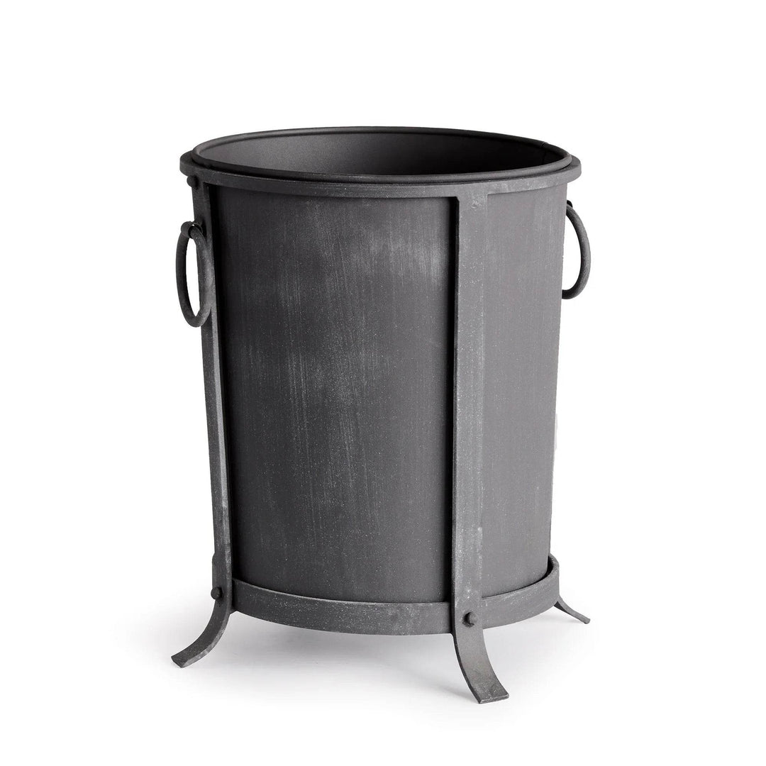 Small iron planter with a tapered round body, aged zinc finish, ring handles and a raised frame. Industrial Transitional