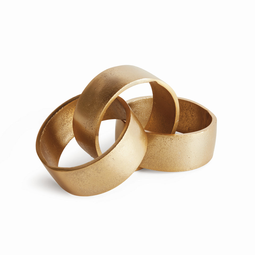 Gold round chain-link sculpture in cast aluminum, with three circular links and textured surfaces on white - Modern Organic