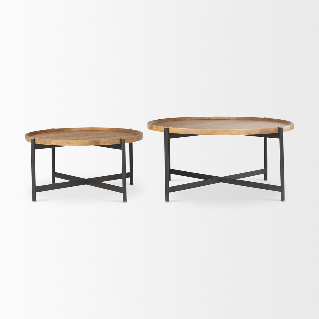Round mango wood coffee tables displayed together with black iron bases – Modern Organic