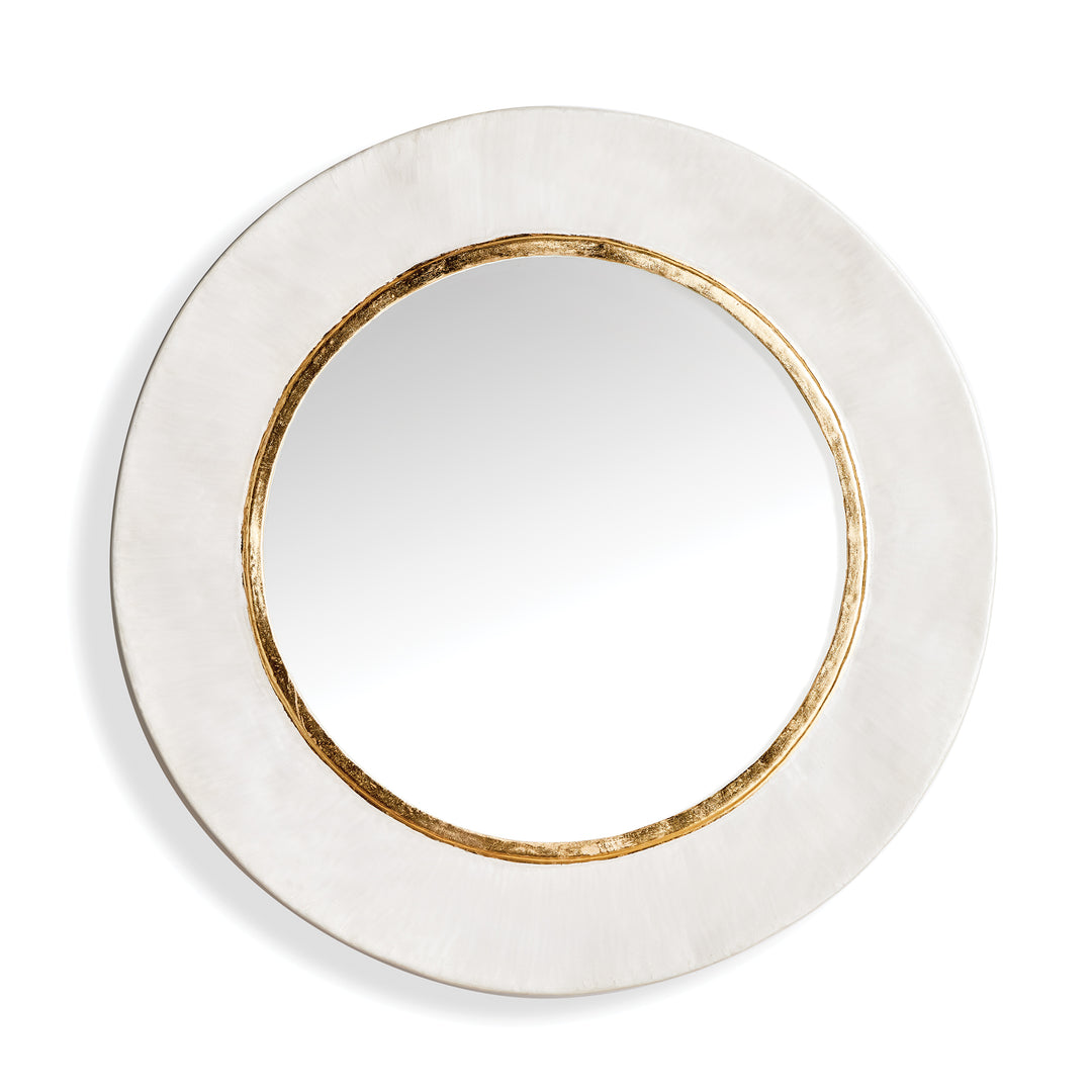 Round white enamel wall mirror with warm gold inner trim and deep profile frame for transitional interiors style.