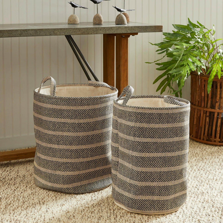 Set of round woven storage baskets styled in a room with rug and console table, black and beige decorative storage for home – Modern Organic.

