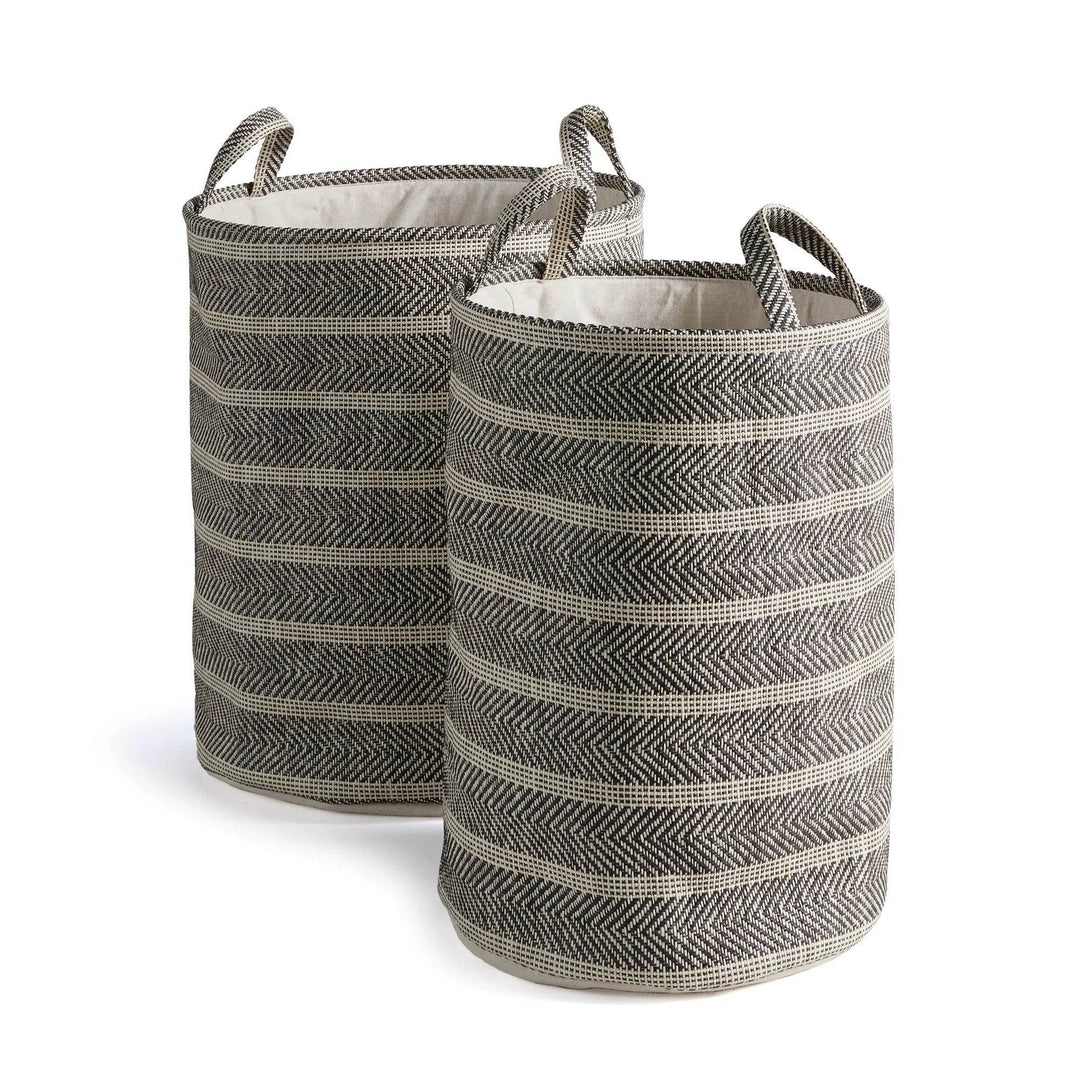 Pair of round woven storage baskets with handles in black and beige on white background, decorative home organization – Modern Organic.

