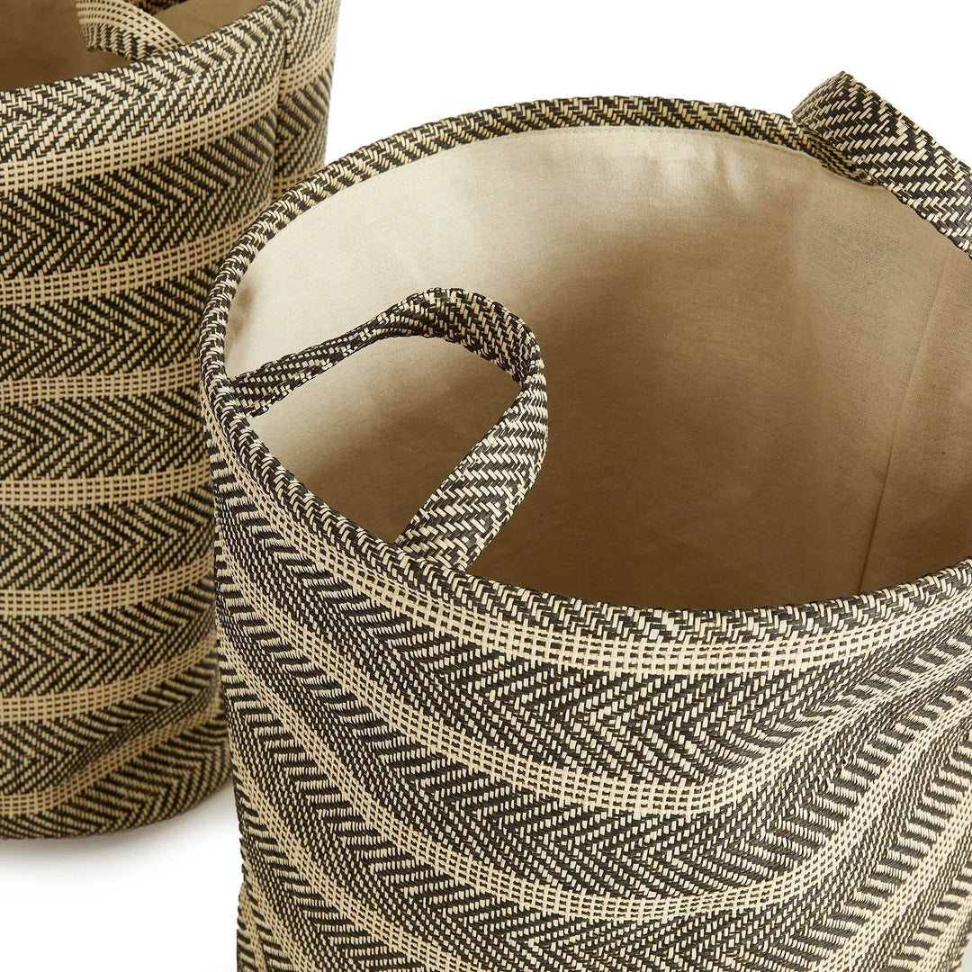 Top view of two round woven storage baskets with handles and cotton liners, black and beige decorative storage bins – Modern Organic.

