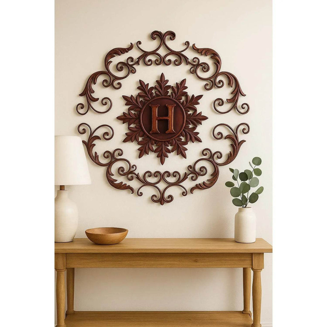 Rustic vintage wall grille with monogram H displayed above a styled bookshelf

