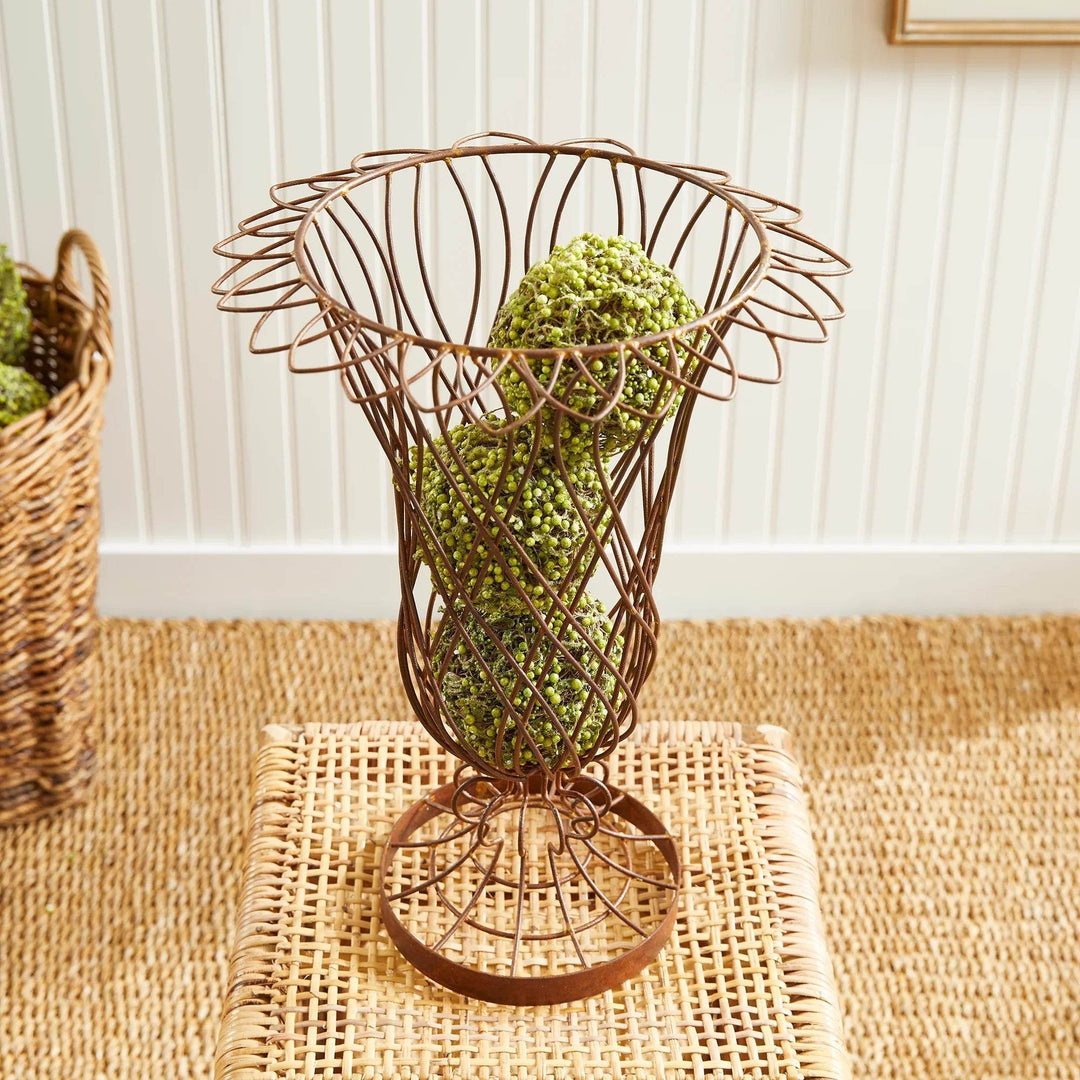 Close-up of wire vase rim and structure filled with green decorative spheres – Vintage Farmhouse style
