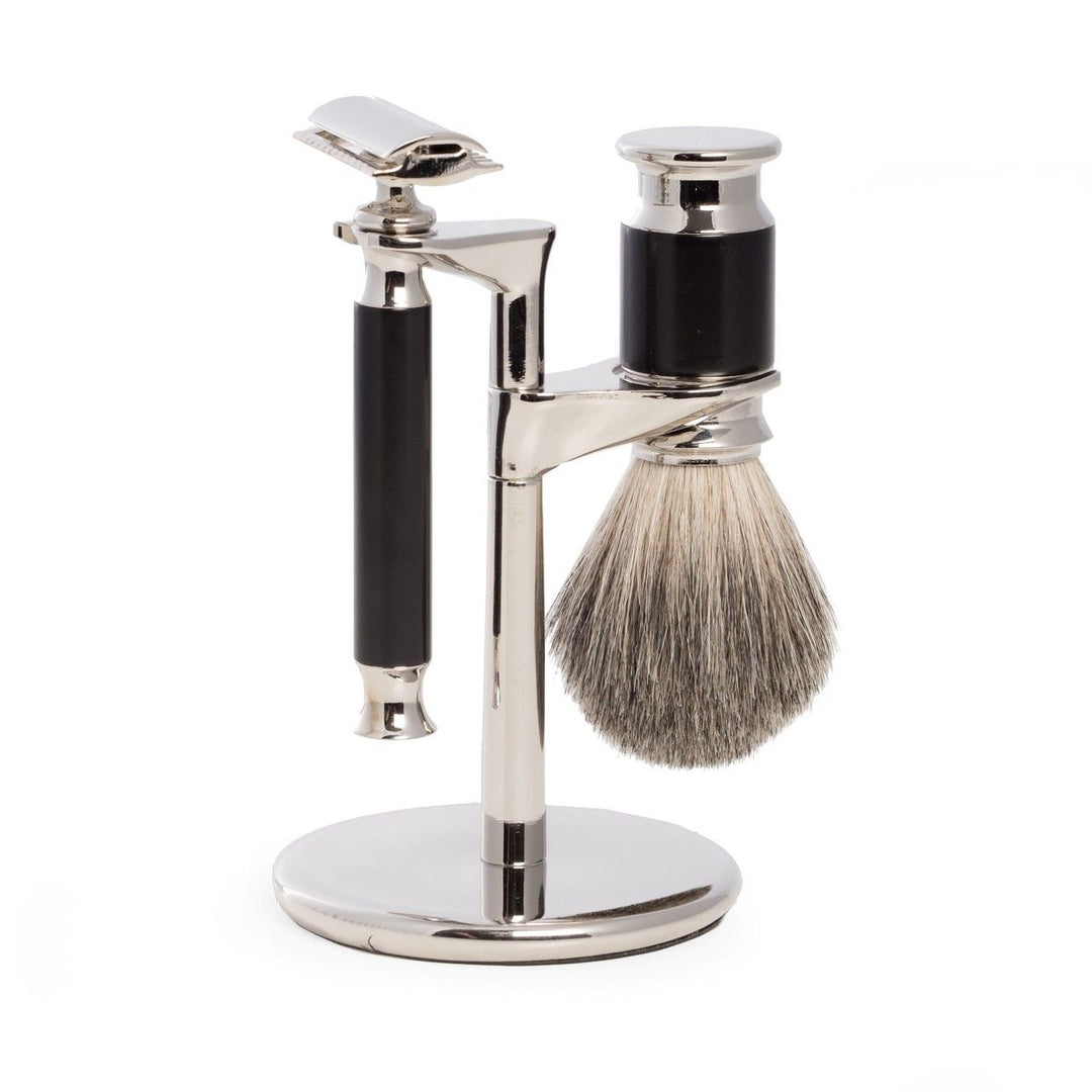 Side view of 3-piece safety razor and pure badger brush shaving set with chrome stand and black accents, standard DE blade compatible.