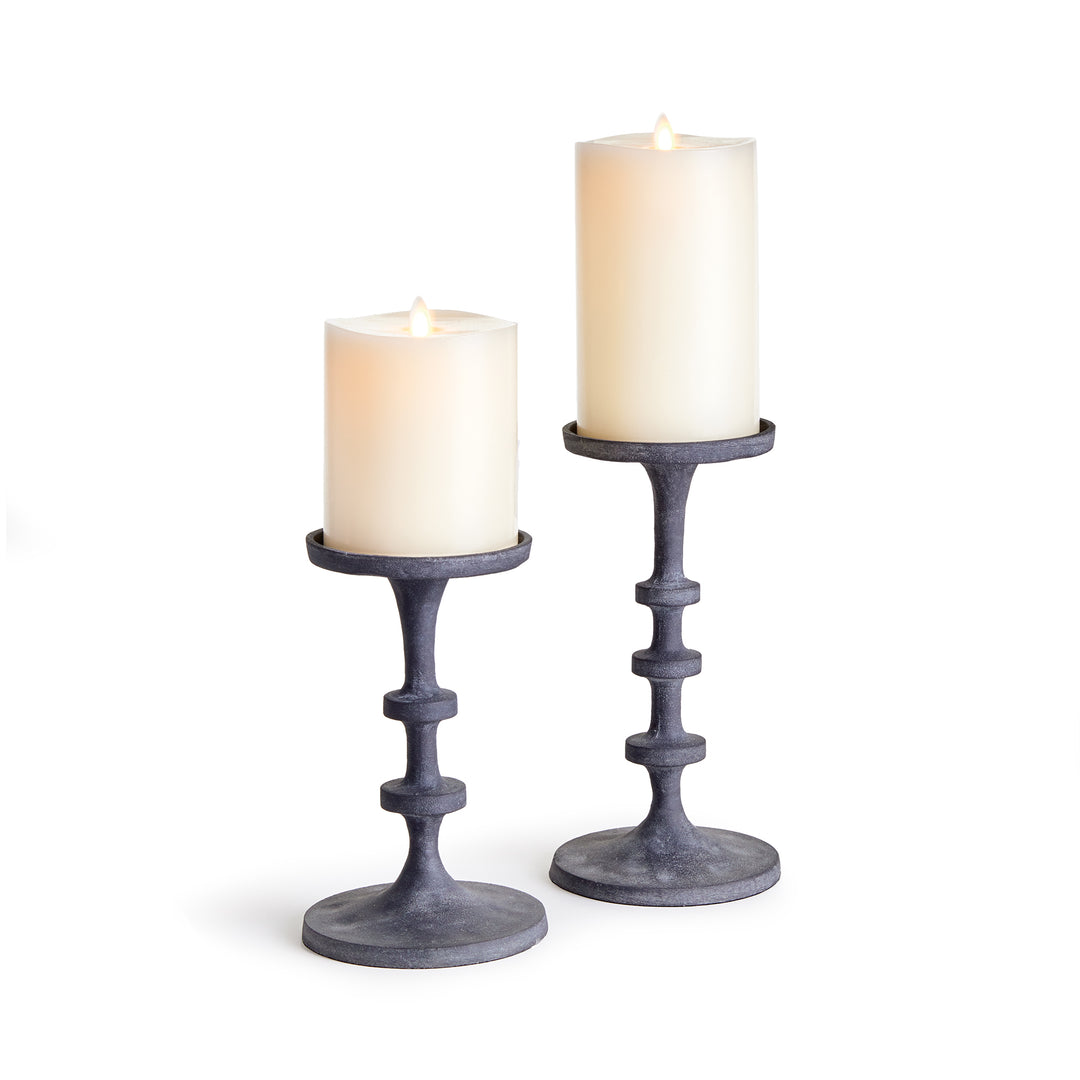 Gray aluminum pillar candle holders with sculptural stacked form for layered mantel styling – Transitional