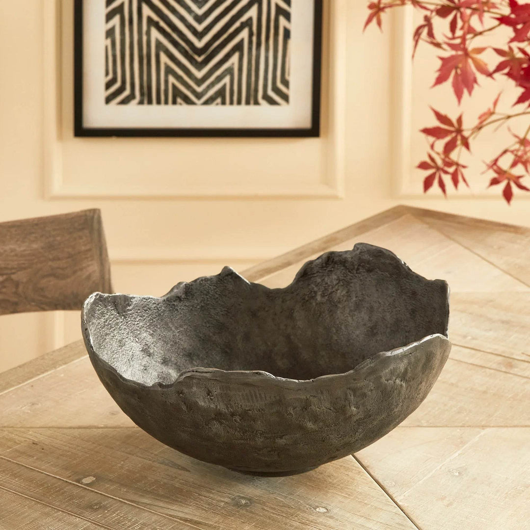 Top view of dark sculptural bowl with irregular rim, perfect centerpiece bowl for modern dining or console styling
