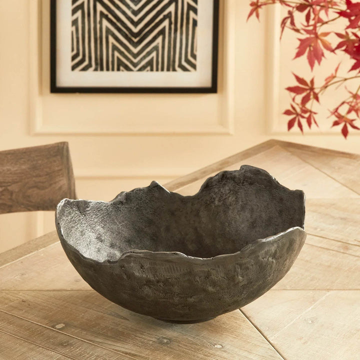 Top view of dark sculptural bowl with irregular rim, perfect centerpiece bowl for modern dining or console styling
