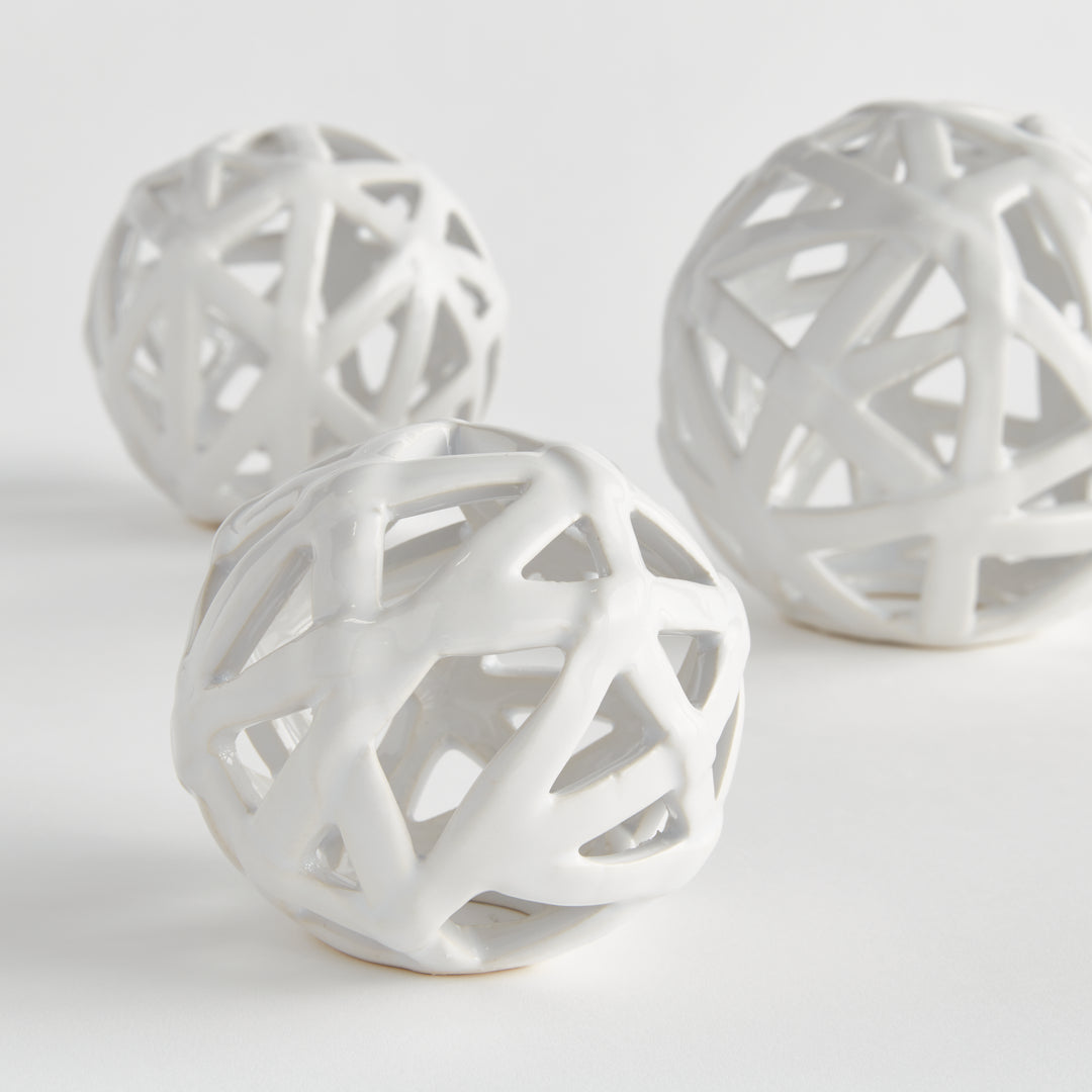 White ceramic decorative orb set with open lattice construction and glossy finish for modern shelf decor – Scandinavian Organic