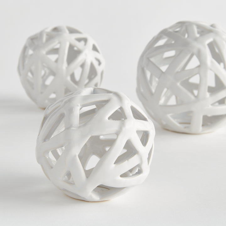 White ceramic decorative orb set with open lattice construction and glossy finish for modern shelf decor – Scandinavian Organic