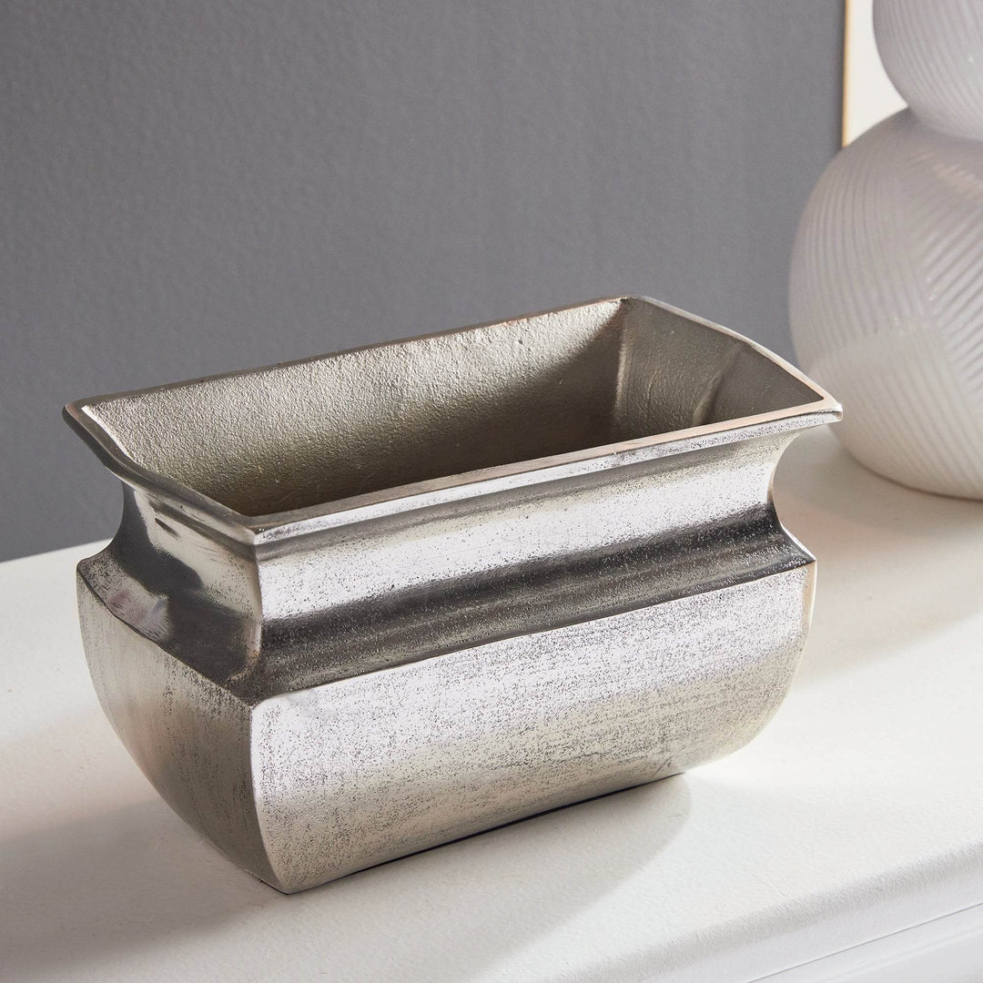 Side profile of decorative rectangular silver aluminum vase

