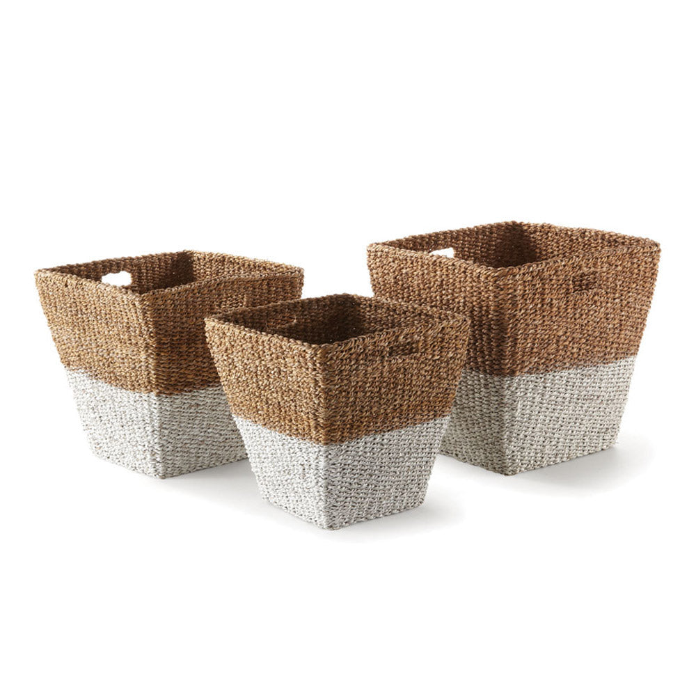 Three rectangular two-tone seagrass storage baskets with cutout handles shown on white background in small, medium, and large sizes.