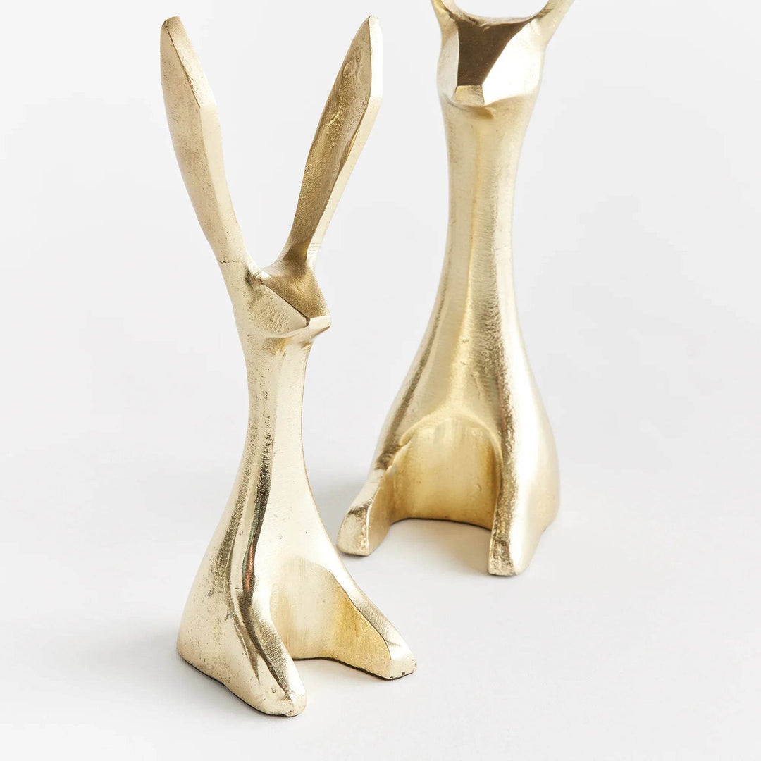Set of modern gold bunny sculptures on white background showing scale and detail – Modern Coastal.
