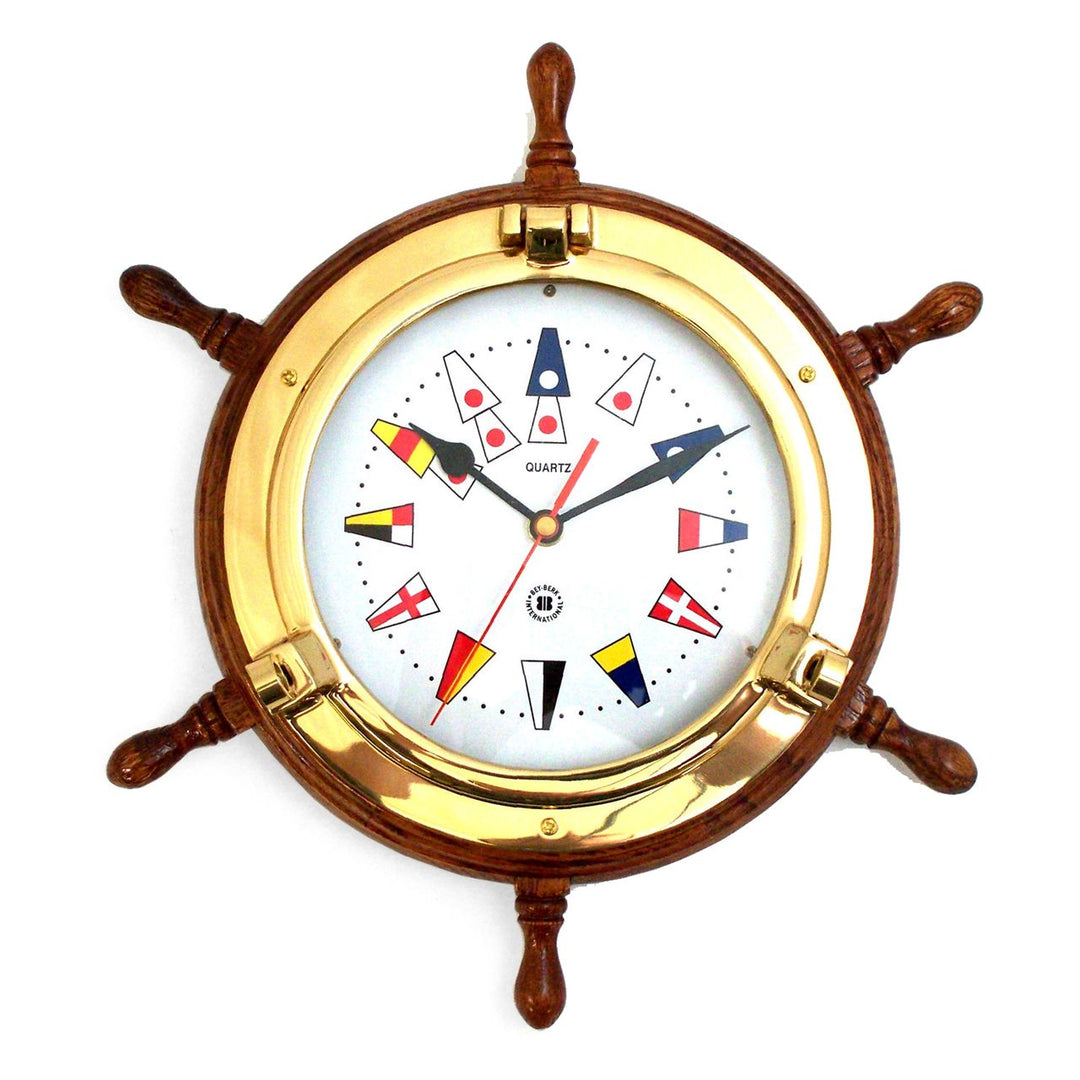 Ship wheel brass wall clock with oak frame and nautical flags dial shown front view for coastal yacht decor style
