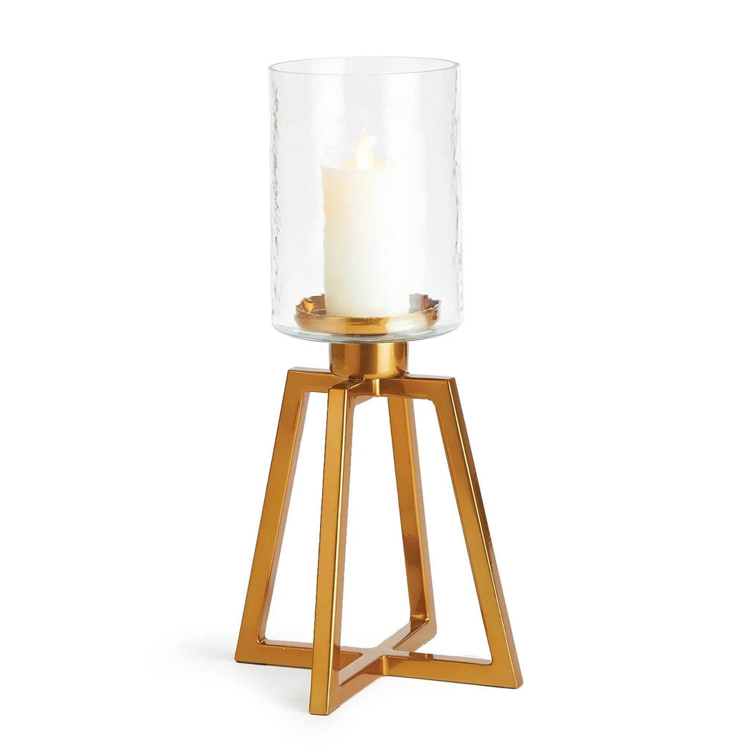 Short glass hurricane candle holder with hammered glass and gold metal base, shown with lit pillar candle – Industrial Modern

