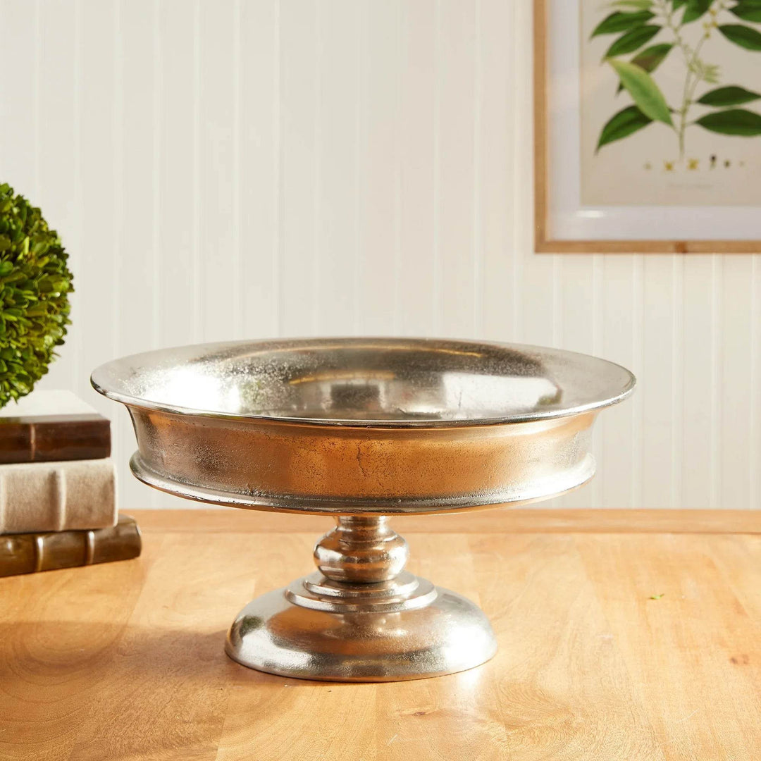 Brushed silver cast aluminum pedestal bowl with round base on wood tabletop, 16 inch wide – Modern Classic

