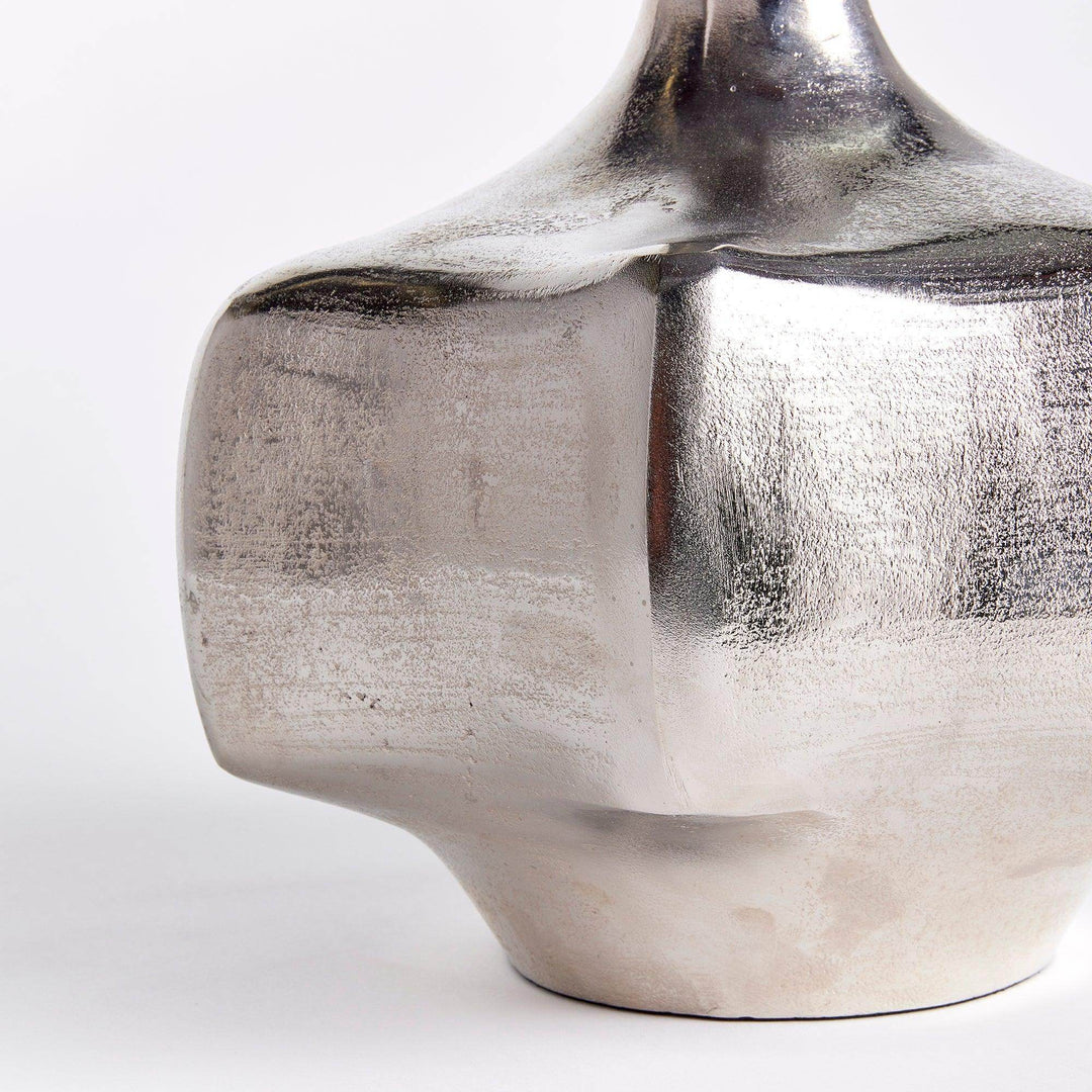 Side detail of silver cast aluminum vase showing textured surface and reflective silver finish, modern coastal styling

