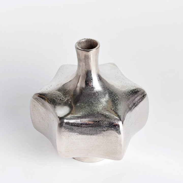 Top angle view of silver cast aluminum vase showing narrow neck and sculptural form, modern home decor accent

