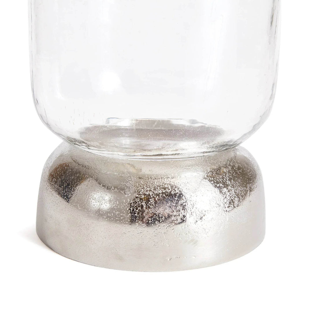 Close-up of silver domed base with textured metallic finish, part of glass hurricane candle holder – Transitional Modern

