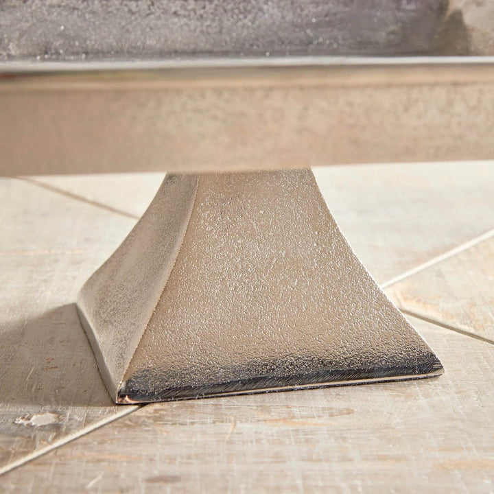 Close-up of brushed nickel pedestal tray base, cast aluminum with subtle texture for modern traditional decorative styling.

