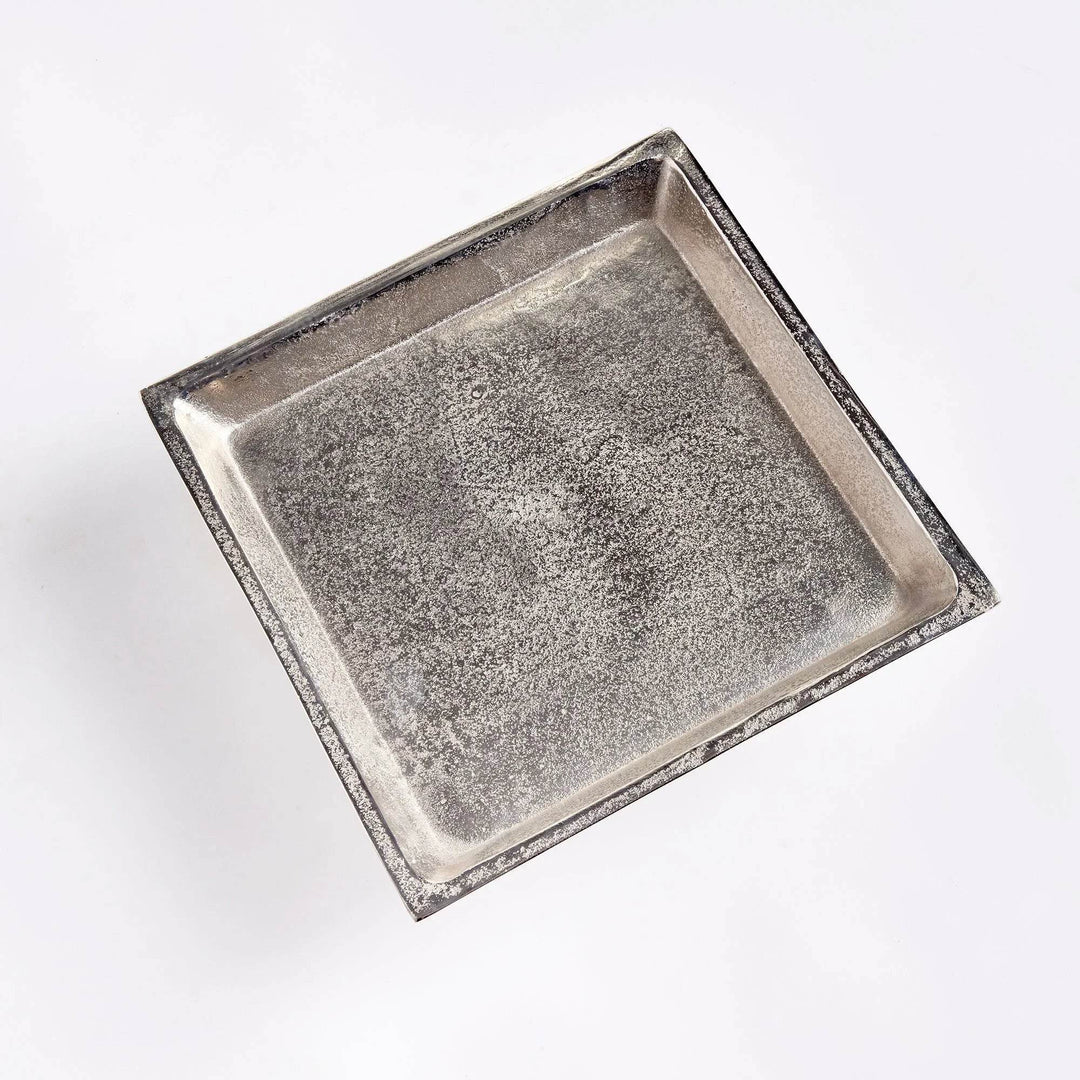 Top view of brushed nickel silver pedestal tray, cast aluminum construction for displaying candles, books, or decor.

